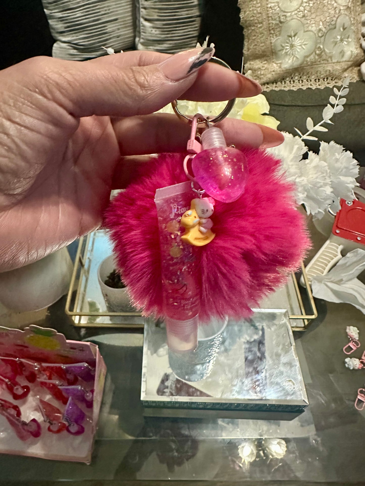 Pompom keychain with lip gloss