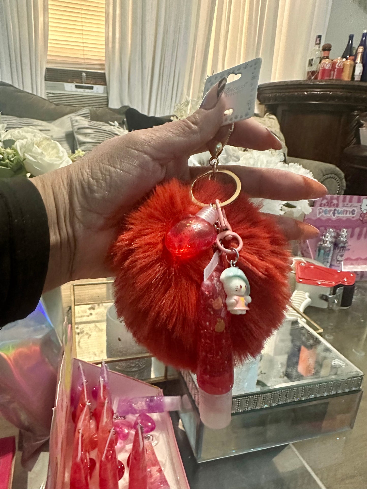Pompom keychain with lip gloss